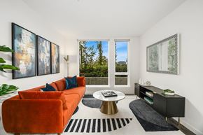Bellevue apartment for rent - a living room with a orange couch and a coffee table