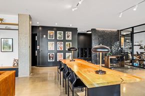 Seattle apartment for rent - a dining room with a wooden table and black chairs