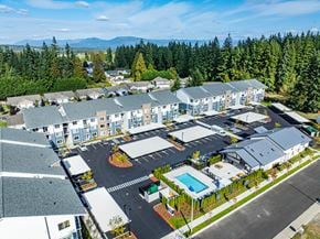 Arlington apartment for rent - A large building complex with a pool in the middle.
