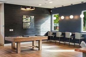 Arlington apartment for rent - A dining room with a wooden table and chairs.