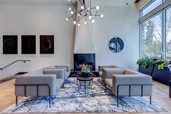Seattle apartment for rent - a living room with couches and chairs and a fireplace
