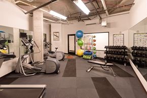 Seattle apartment for rent - a spacious fitness center with treadmills and other exercise equipment