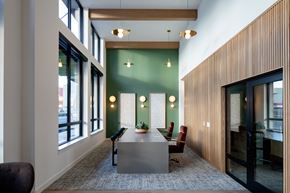Shoreline apartment for rent - A conference room with a long table and chairs.