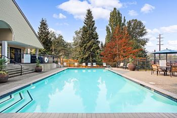 Resort-inspired pool with views of the seattle skyline