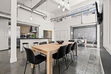 Seattle apartment for rent - A modern kitchen with a dining table and chairs.
