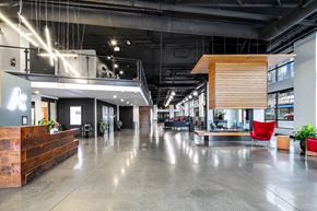 Seattle apartment for rent - the lobby of a large office space with chairs and desks