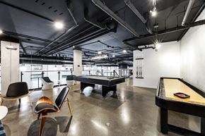 Seattle apartment for rent - a game room with a pool table and ping pong