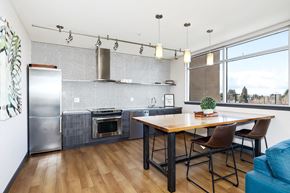 Seattle apartment for rent - A kitchen with a wooden table and chairs.