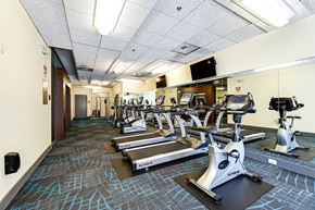 Seattle apartment for rent - A gym with treadmills, elliptical machines, and other cardio equipment.