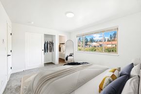 Lynnwood apartment for rent - a bedroom with a bed and a large window