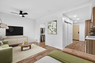 Seattle apartment for rent - A living room with a green couch and a coffee table.