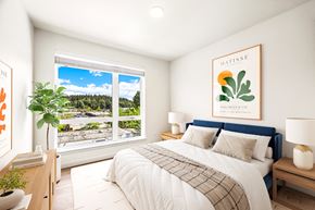 Bellevue apartment for rent - a bedroom with a bed and a large window