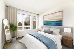 Poulsbo apartment for rent - a bedroom with a large window and a large painting on the wall