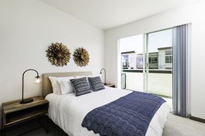 Seattle apartment for rent - a bedroom with a bed and a large window