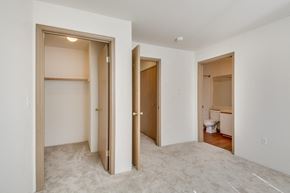 Poulsbo apartment for rent - a bedroom and a hallway with doors to a bathroom and a toilet