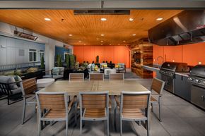 Tacoma apartment for rent - a large dining room with a table and chairs and a kitchen