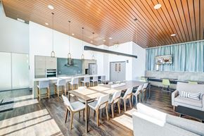 Seattle apartment for rent - A modern dining room with a wooden table and chairs.