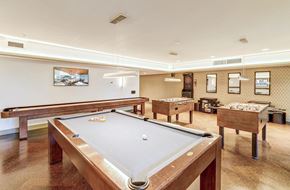 Seattle apartment for rent - A pool table is in the middle of a room with a picture hanging on the wall.