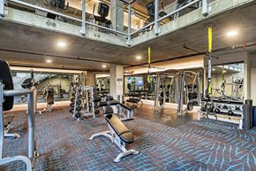 Seattle apartment for rent - A gym with a variety of equipment including weights and cardio machines.