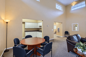 Olympia apartment for rent - A conference room with a table, chairs, and a couch.