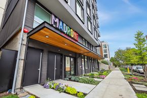 Seattle apartment for rent - a hotel with a colorful sign on the front of it