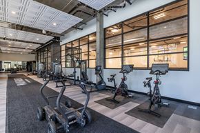 Seattle apartment for rent - a gym with weights machines and glass walls