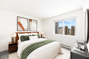 Seattle apartment for rent - A bedroom with a large bed and a television.