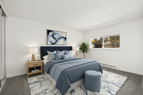 Kent apartment for rent - A bedroom with a large bed and a painting on the wall.