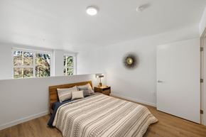 Seattle apartment for rent - a bedroom with a bed and a window