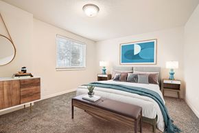Vancouver apartment for rent - an open bedroom with a bed and a window