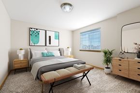Vancouver apartment for rent - A bedroom with a bed, nightstands, a bench, and a plant.