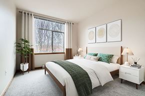 Portland apartment for rent - a bedroom with a bed and a window