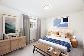 Seattle apartment for rent - a bedroom with a large bed and a table