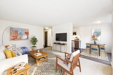 Seattle apartment for rent - a living room with a couch and a table and a television