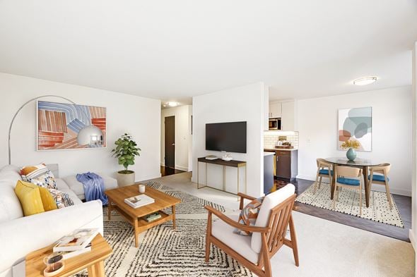 Seattle apartment for rent - a living room with a couch and a table and a television