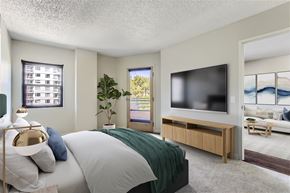 Portland apartment for rent - a bedroom with a large bed and a tv