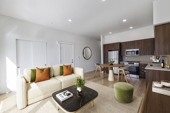 Bainbridge Island apartment for rent - A modern living room with a white sofa and a coffee table.