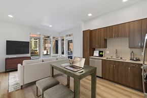 Bainbridge Island apartment for rent - A modern kitchen with a table and chairs in the foreground.