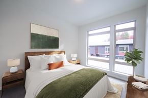 Bainbridge Island apartment for rent - a bedroom with a large bed and a large window