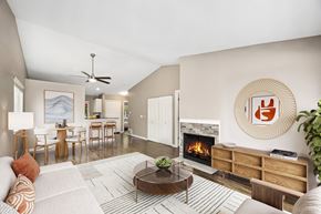 Bellevue townhouse for rent - A living room with a fireplace and a painting on the wall.