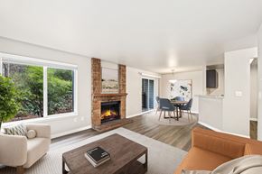 Bothell apartment for rent - A living room with a fireplace and a couch.