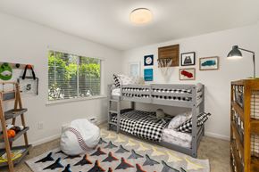 Federal Way apartment for rent - a childrens bedroom with bunk beds and a baseball rug