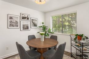 Kirkland apartment for rent - a dining room with a table and four chairs