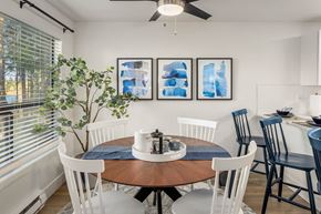 Milton apartment for rent - a dining room with a table and chairs and a window