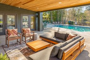 Federal Way apartment for rent - a patio with a pool and a couch and chairs