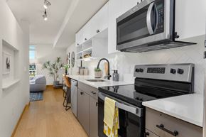Seattle apartment for rent - a kitchen with a stove and a microwave