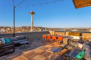 Seattle apartment for rent - a rooftop patio with a view of the stratosphere tower and the space needle