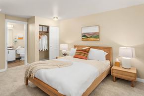 Lynnwood apartment for rent - a bedroom with a bed and a bathroom with a toilet