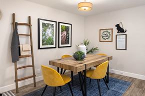 Everett apartment for rent - a dining room with a wooden table and yellow chairs