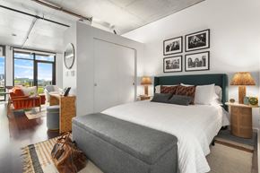 Seattle apartment for rent - a bedroom with a bed and a large window
